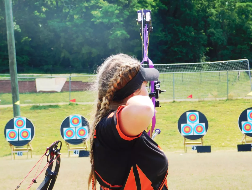 College Archer Kicking Bear